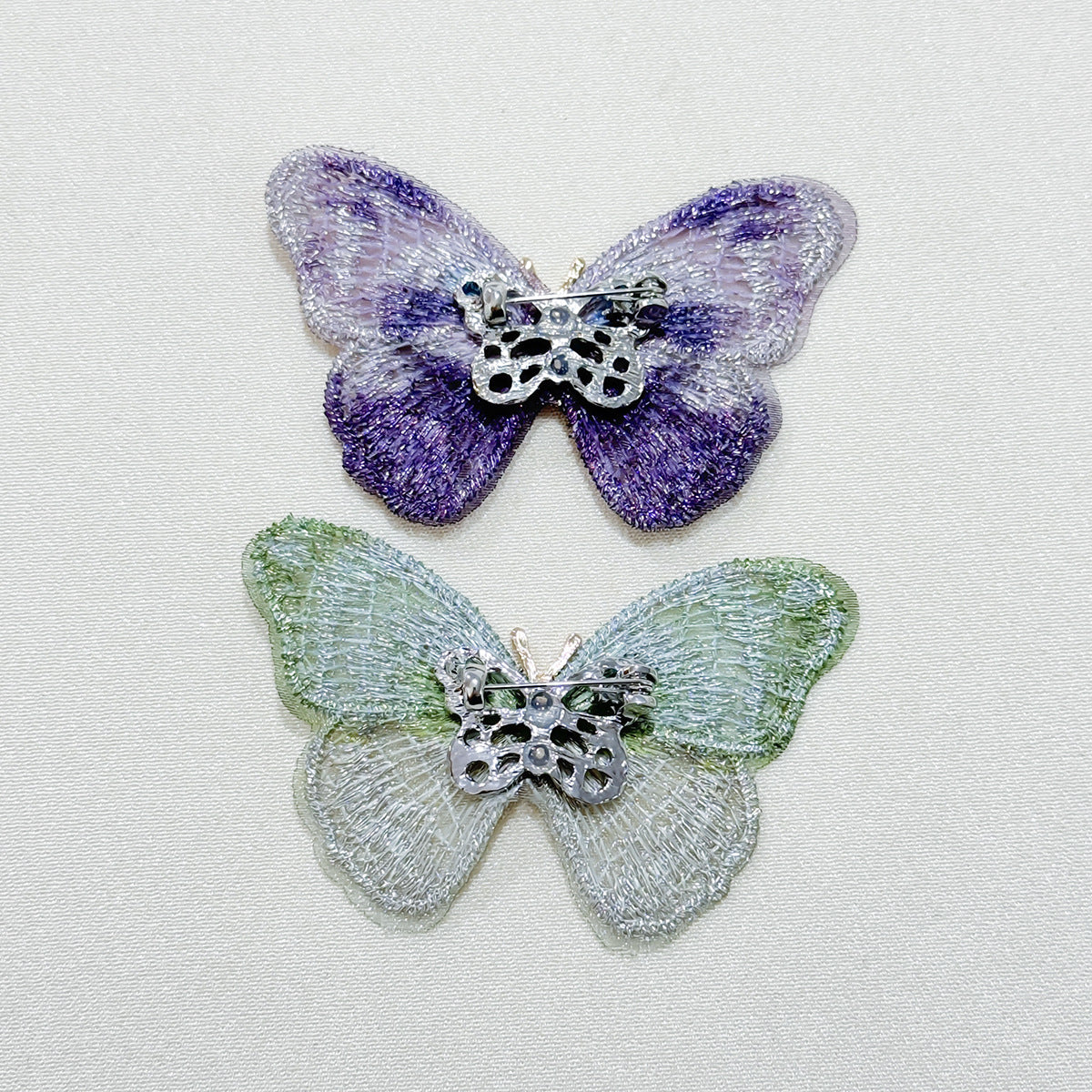 Embroidered butterfly brooch in purple