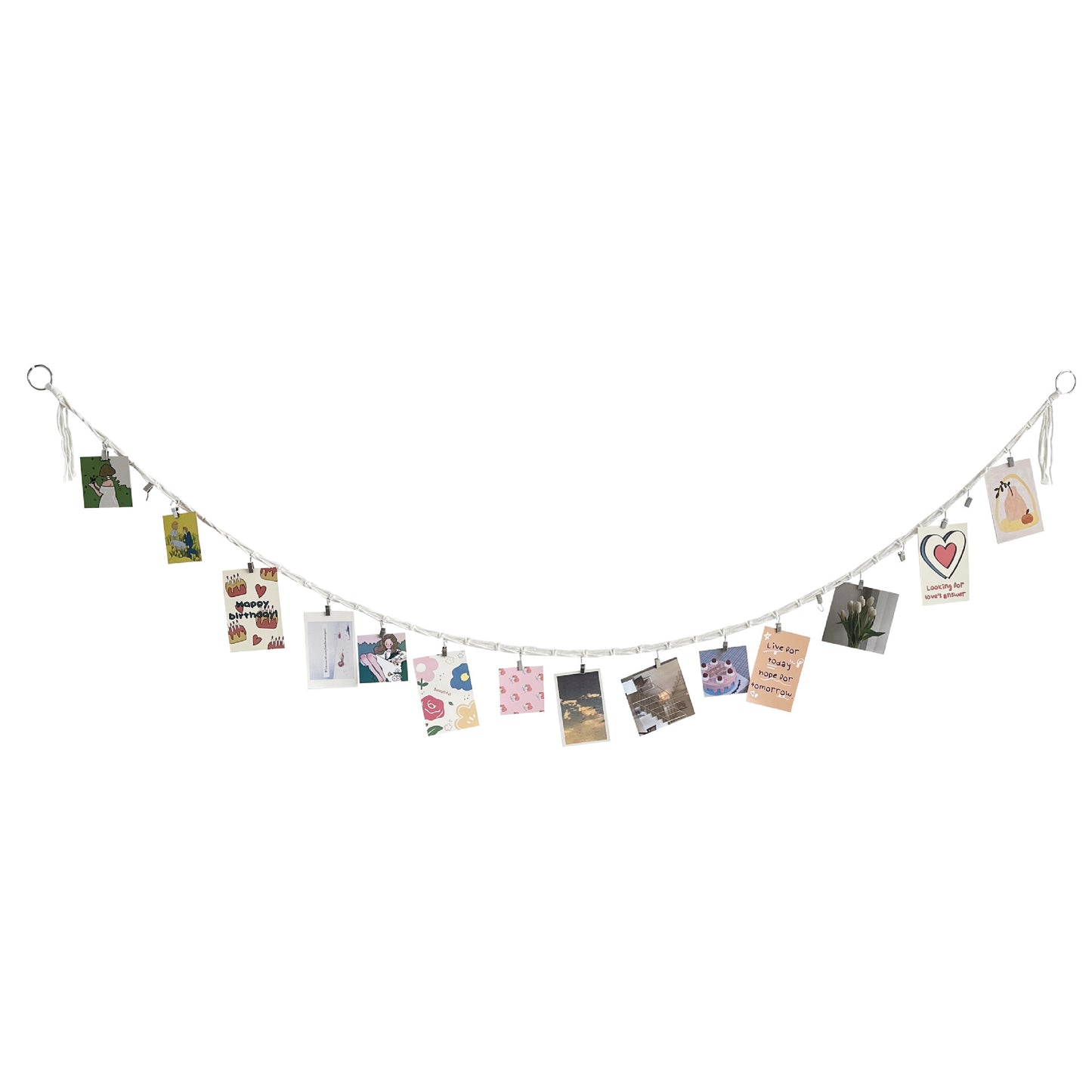 Close-up of clips holding photos on cotton string - image 2