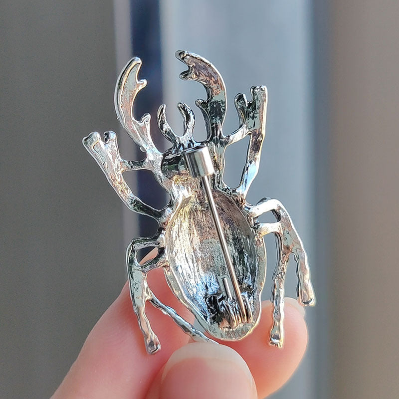 Fashionable beetle pin on jacket