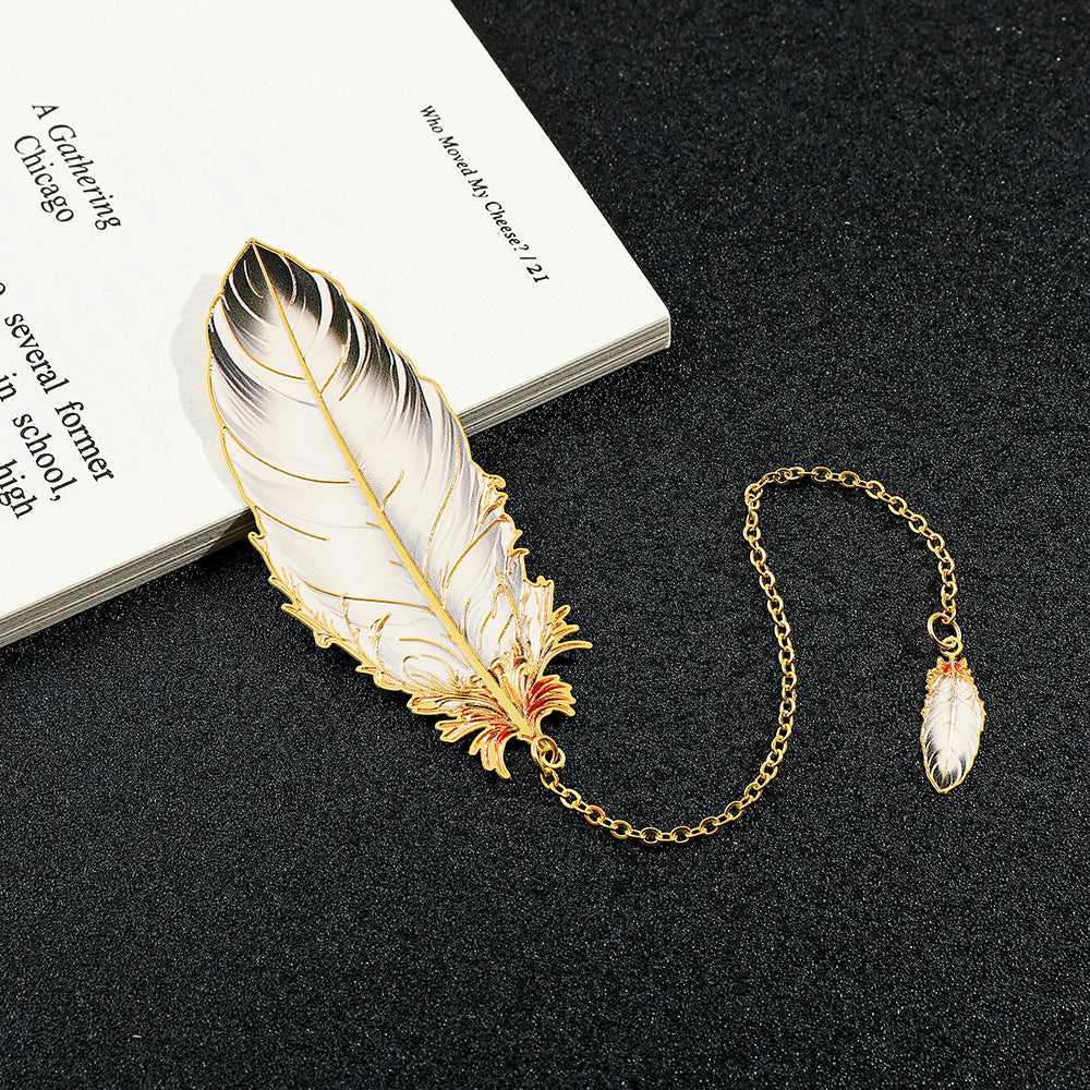 Feather-shaped metal bookmark with dangle image 1