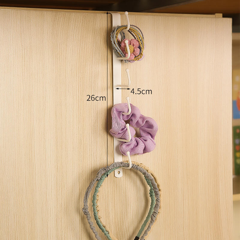 White iron coat rack in modern entryway