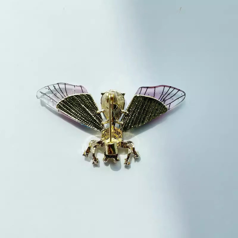 Pink bee brooch with transparent wings