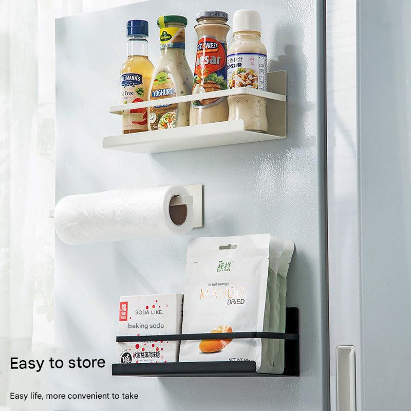 Magnetic paper towel holder mounted on fridge