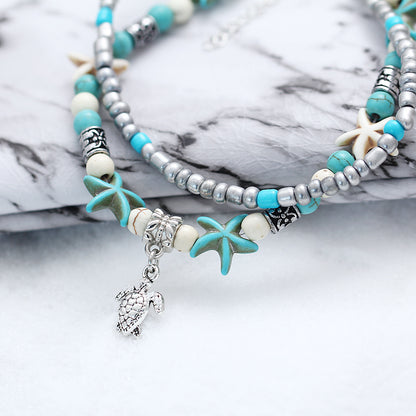 ocean-themed anklet with shells and turtles