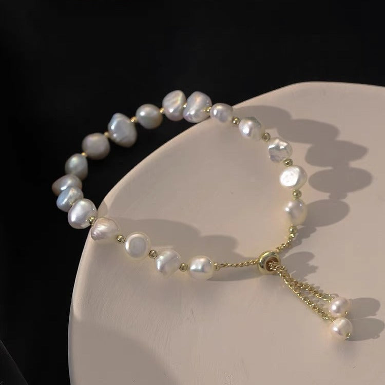 Adjustable faux pearl bracelet pink color