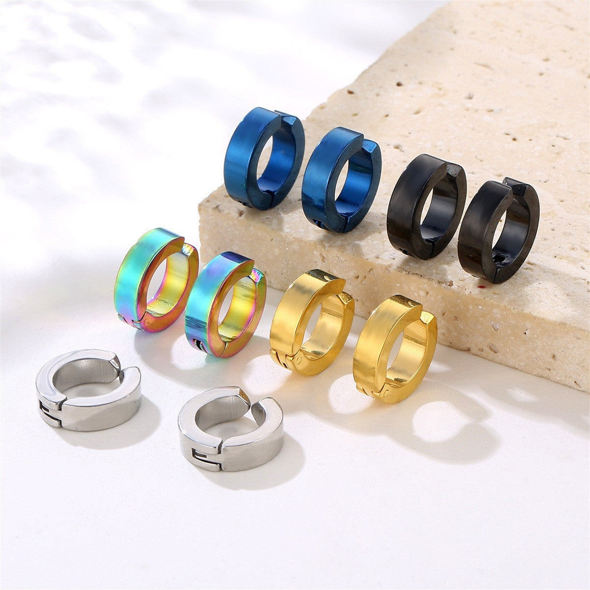 Close up of clip-on earrings in various colors image 2