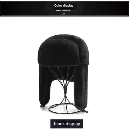 Stylish winter earflap hat on outdoor background