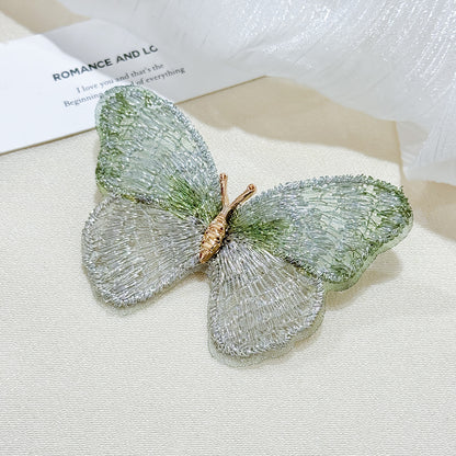 Embroidered butterfly brooch in purple