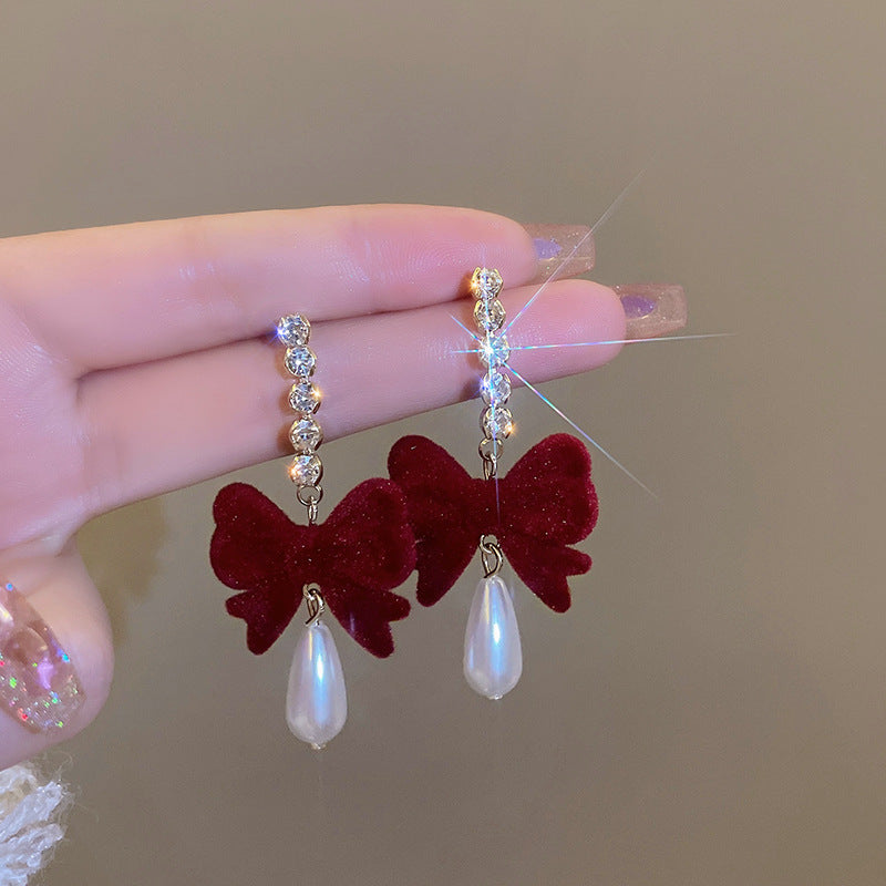 Chic women's bow earrings close up