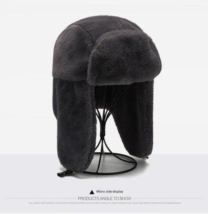 Stylish winter earflap hat on outdoor background