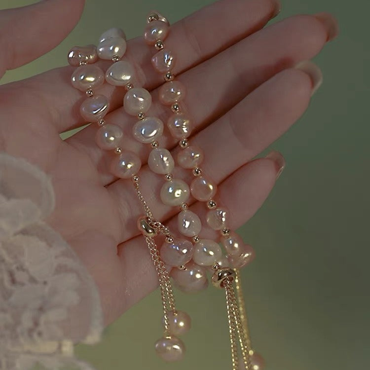 Adjustable faux pearl bracelet pink color