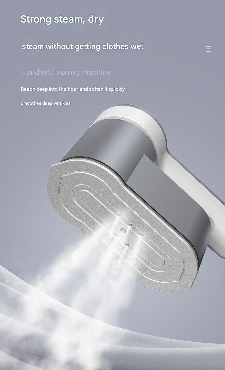 Steam iron in use on fabric