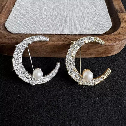 Elegant moon-shaped brooch display - image 7