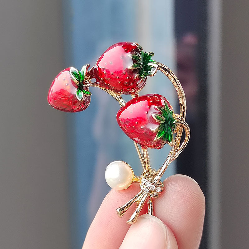 Unique strawberry design brooch on fabric