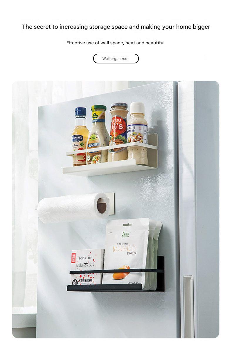 Magnetic paper towel holder mounted on fridge