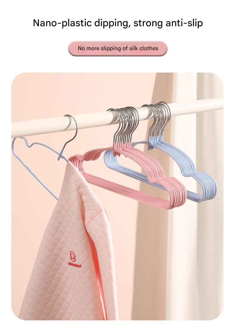 Colorful children's hangers displayed in a closet