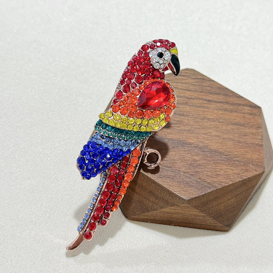 Elegant parrot pin brooch on a scarf