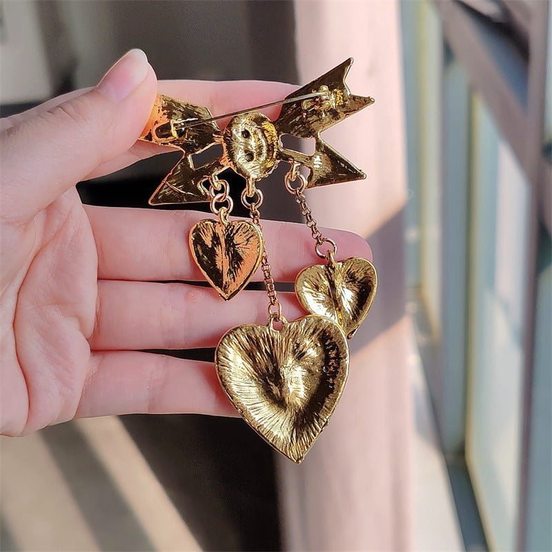 Elegant red Cupid arrow pin with stylish design