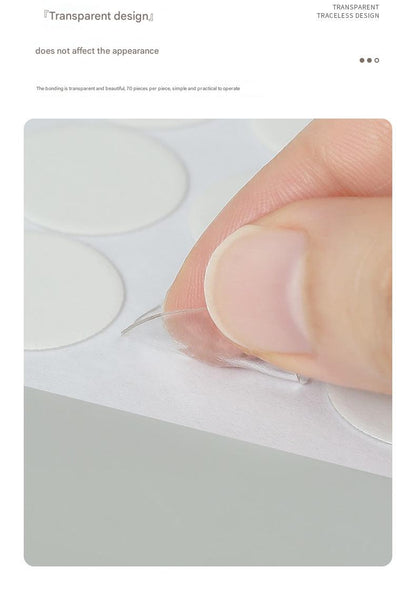 Multiple adhesive dots on a surface