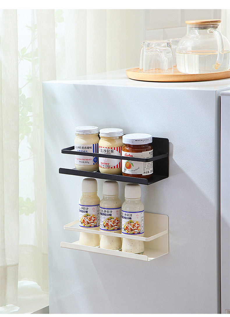 Magnetic paper towel holder mounted on fridge