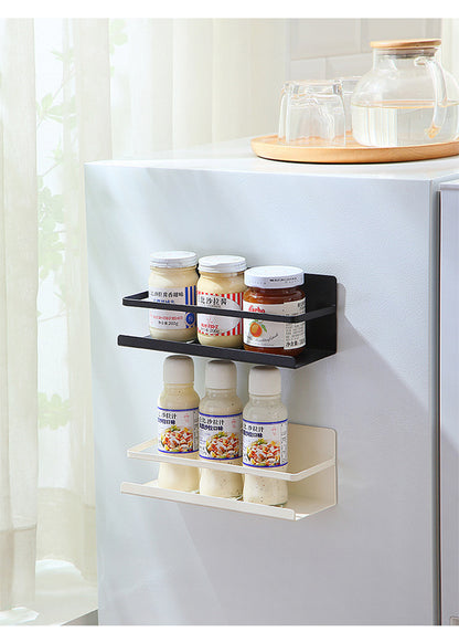 Magnetic paper towel holder mounted on fridge