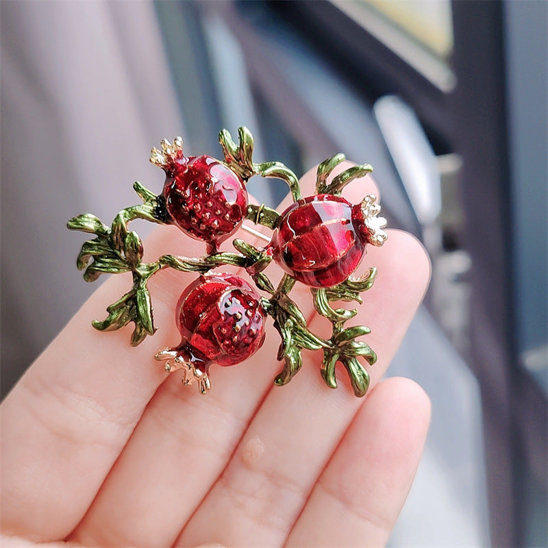 Vintage fruit brooch on clothing