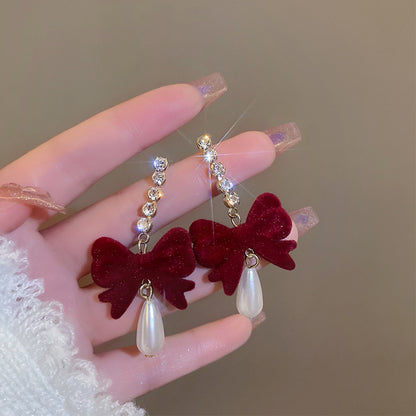Chic women's bow earrings close up