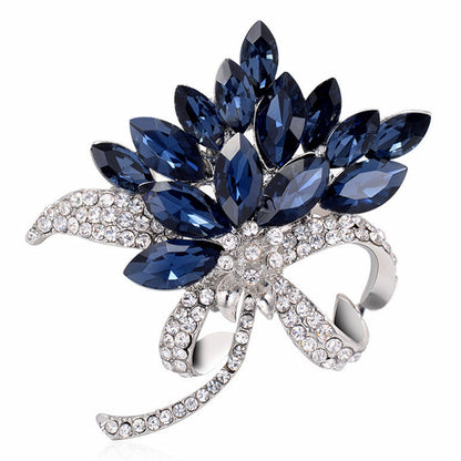 close-up of fashion brooch with rhinestones and floral design