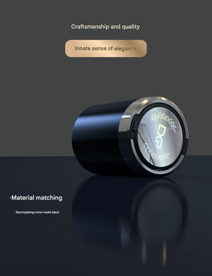 Close-up of automatic ashtray in car cup holder