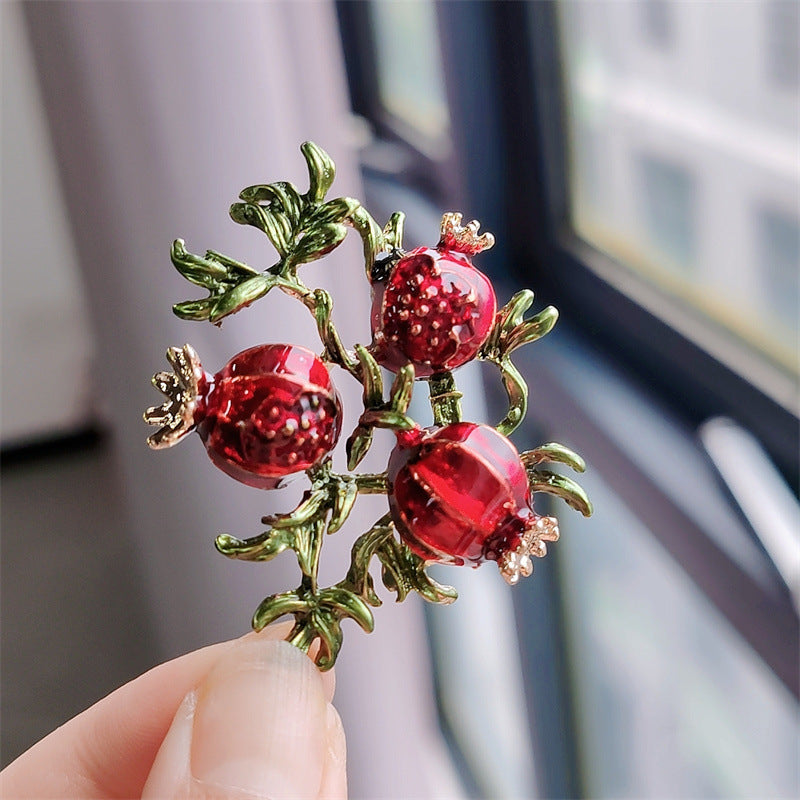 Vintage fruit-themed brooch close-up